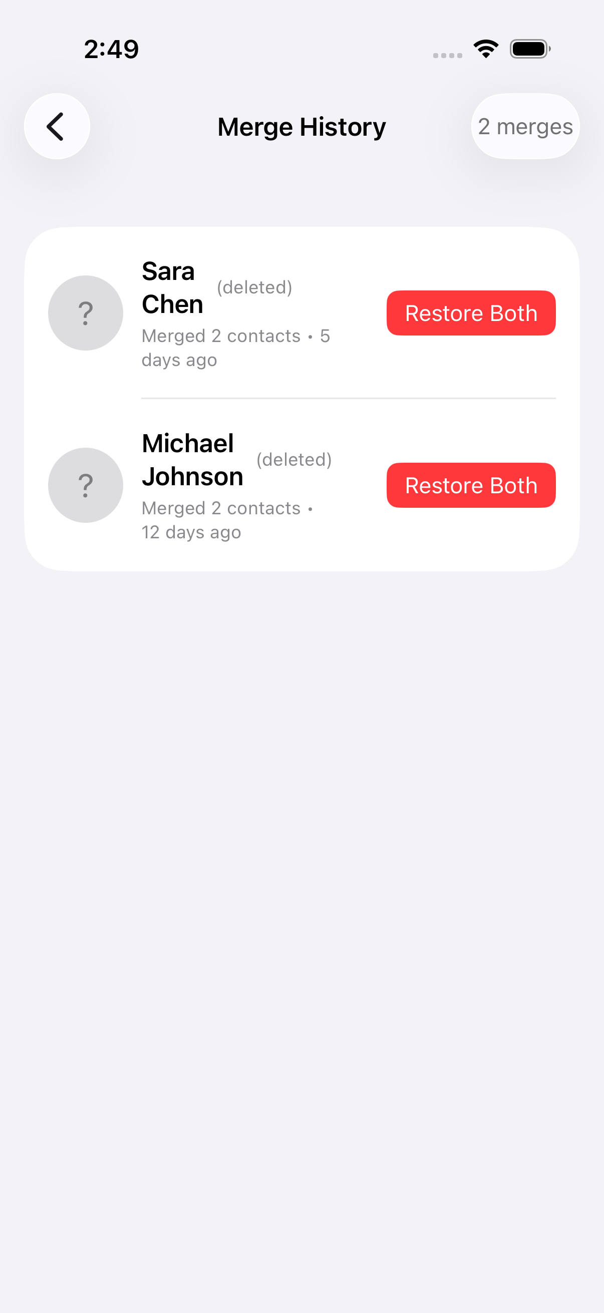 Merge history showing merged contact groups with deleted tags and restore buttons